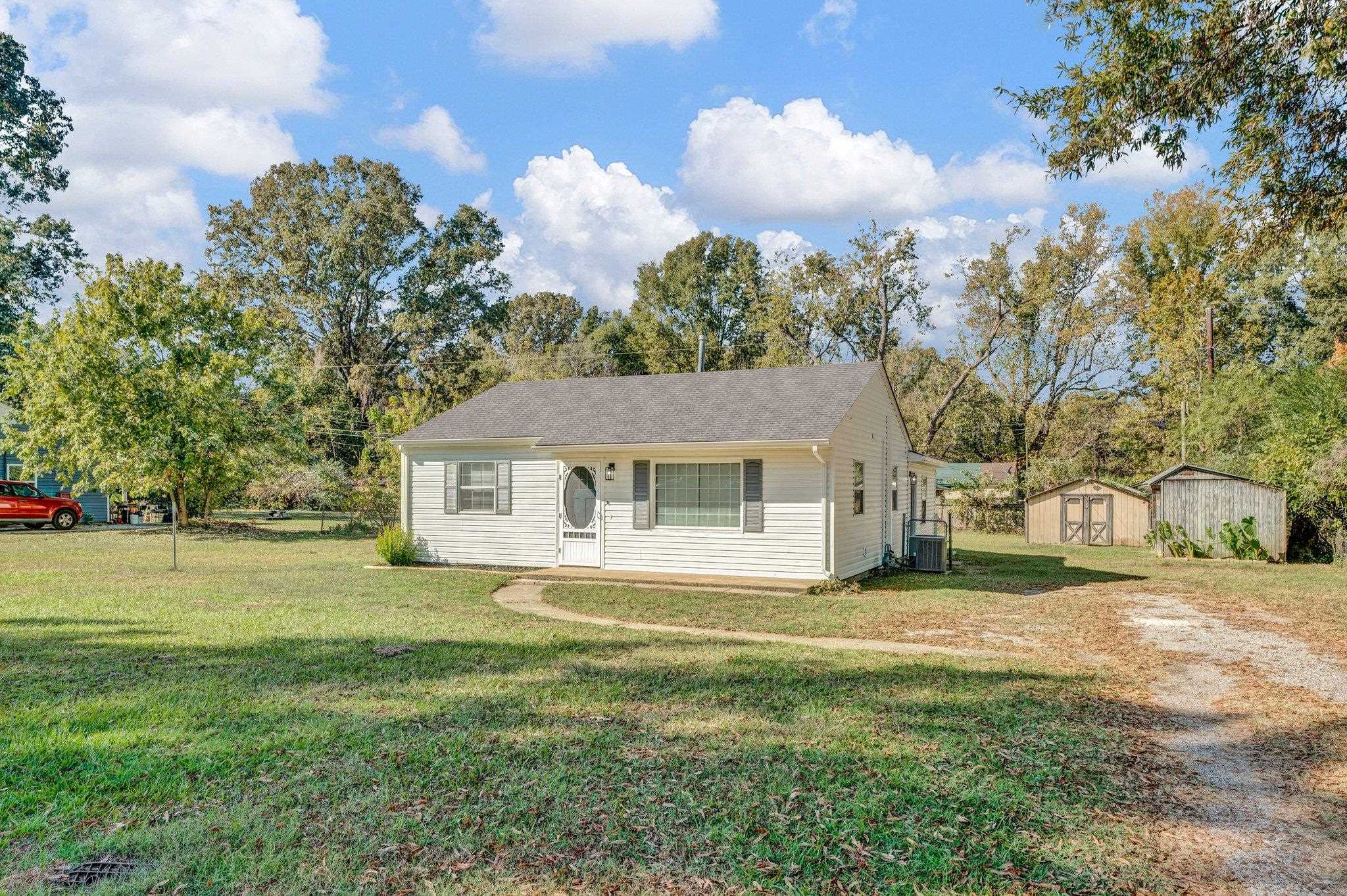7829 Admiral Road Millington, TN 38053 - Photo 4 of 28 Ranch-style house featuring a front lawn, a shed, and central air condition unit