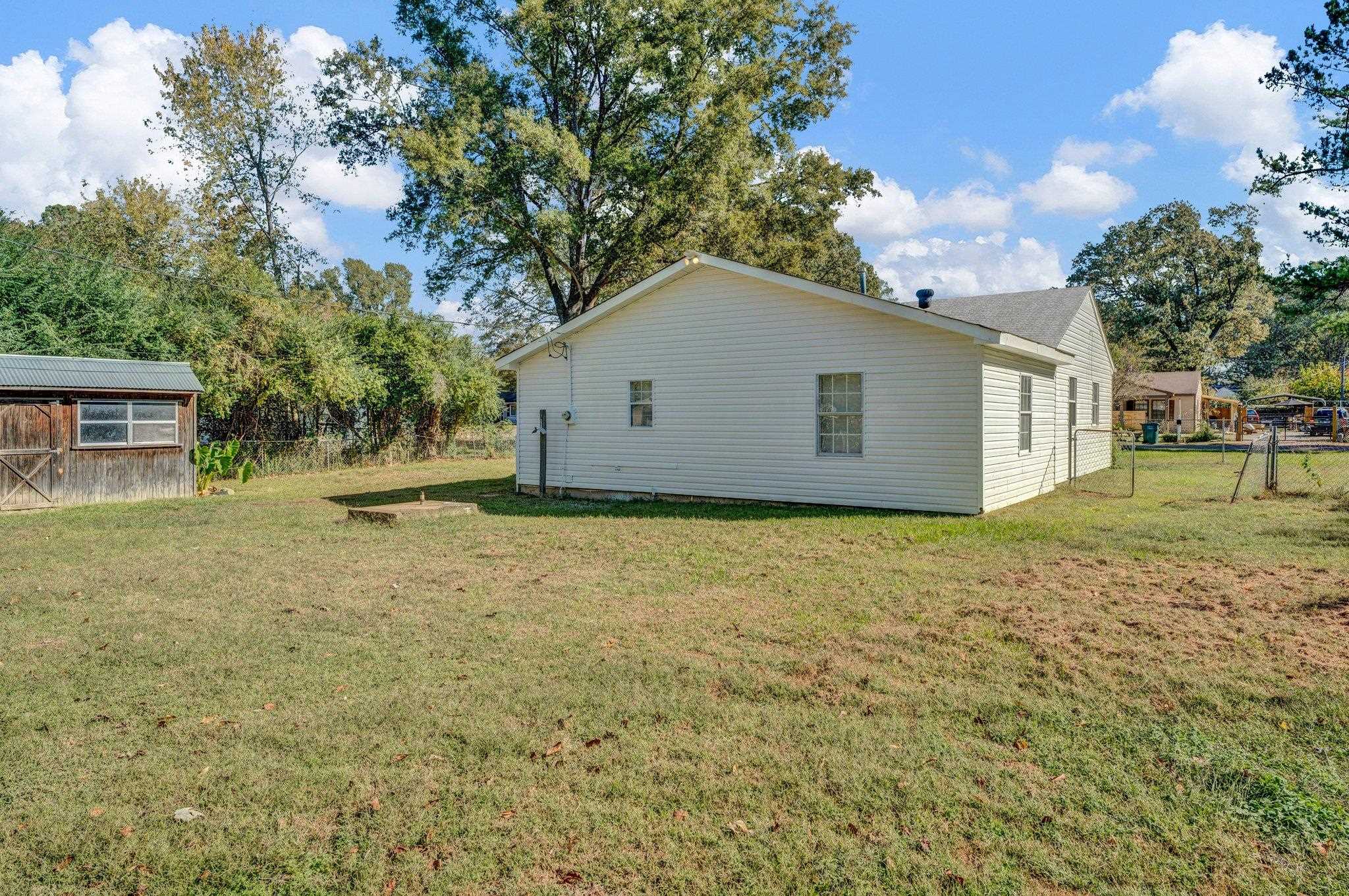 7829 Admiral Road Millington, TN 38053 - Photo 6 of 28 View of property exterior featuring an outdoor structure and a yard