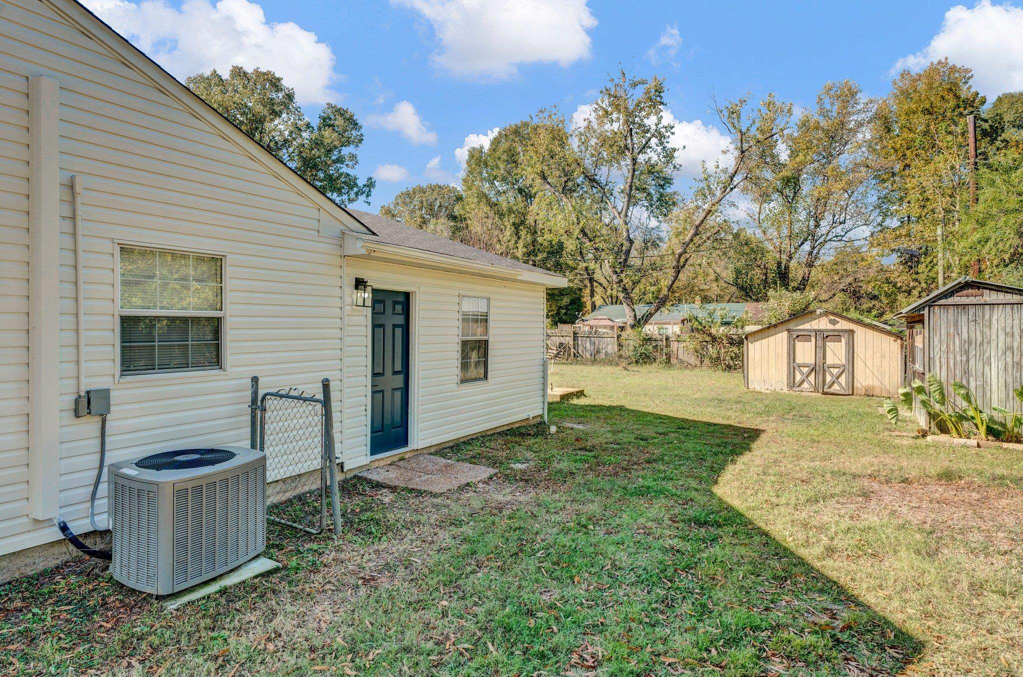 7829 Admiral Road Millington, TN 38053 - Photo 8 of 28 View of yard with a shed and central air condition unit