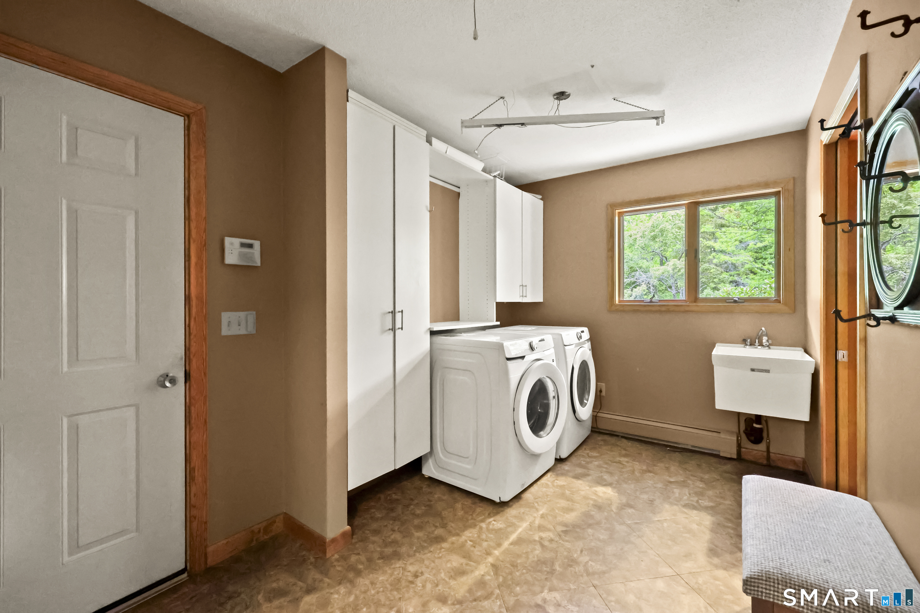 96 Spak Road Willington, CT 06279 - Photo 28 of 40 Laundry Room/Mud Room with direct access to attached garage and additional private powder room.