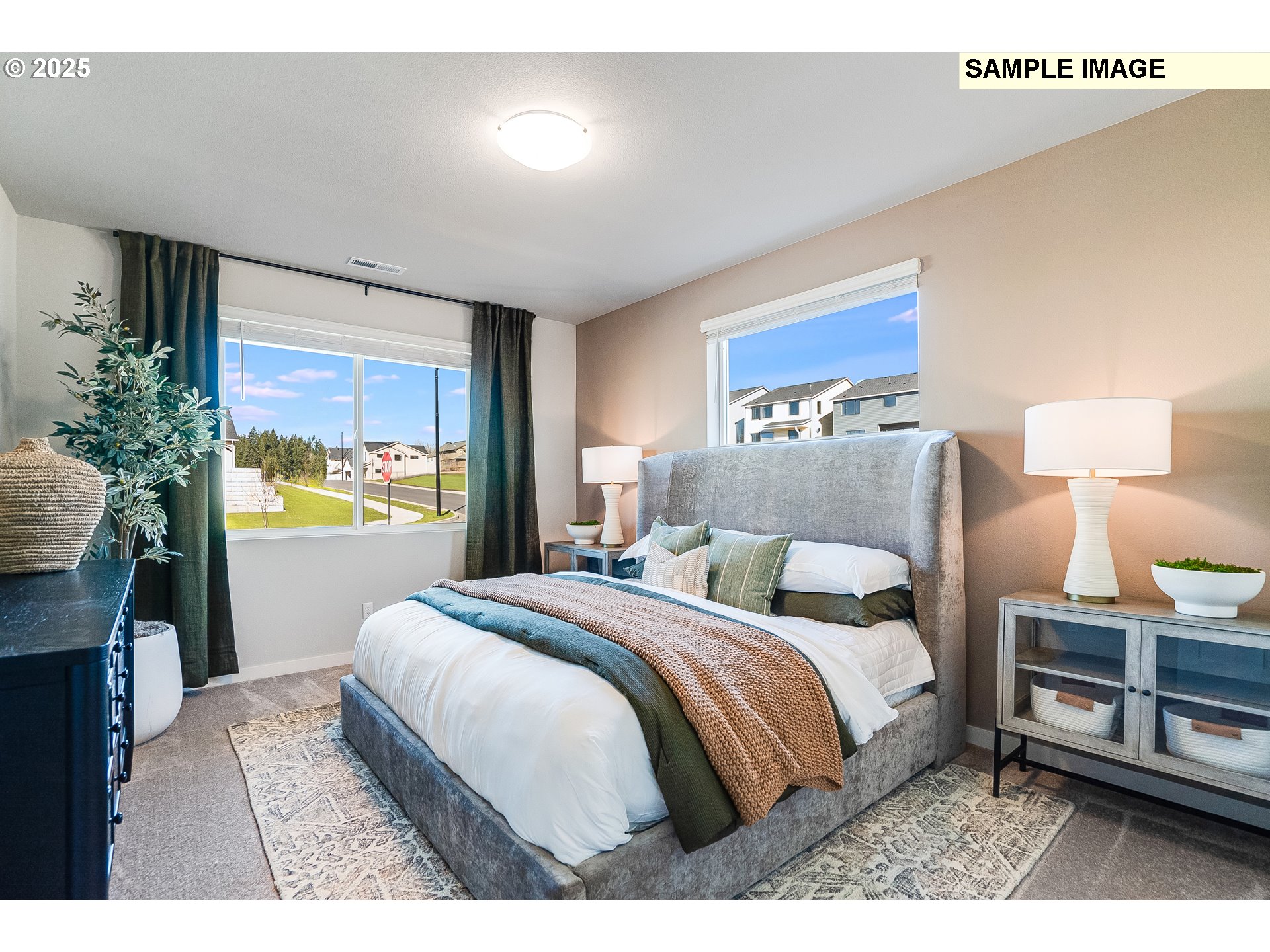 16698 Southwest Rubicon Lane Portland, OR 97224 - Photo 11 of 28 a bedroom with a bed and a lamp on the dresser