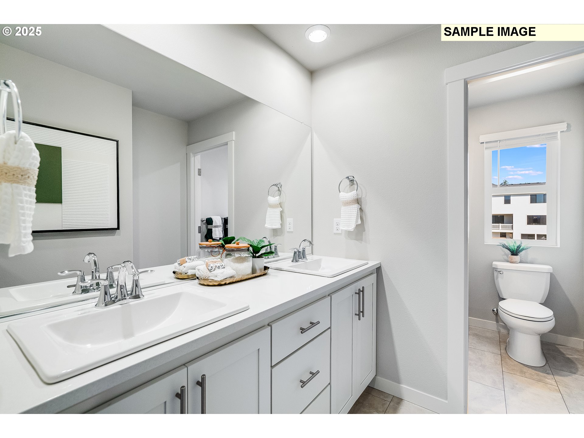 16698 Southwest Rubicon Lane Portland, OR 97224 - Photo 18 of 28 a bathroom with a sink a toilet and a mirror