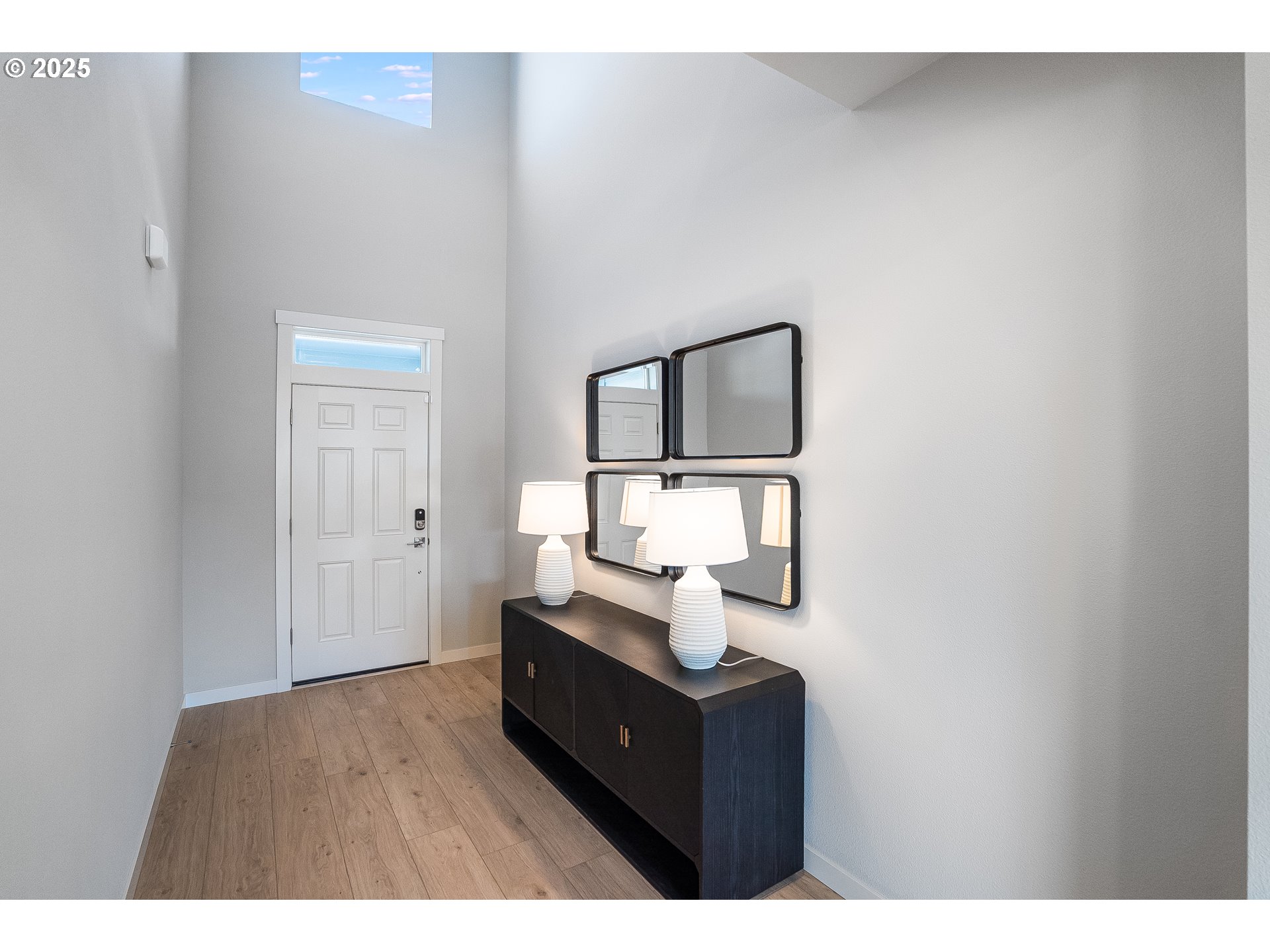 16698 Southwest Rubicon Lane Portland, OR 97224 - Photo 2 of 28 a living room with a bed and mirror