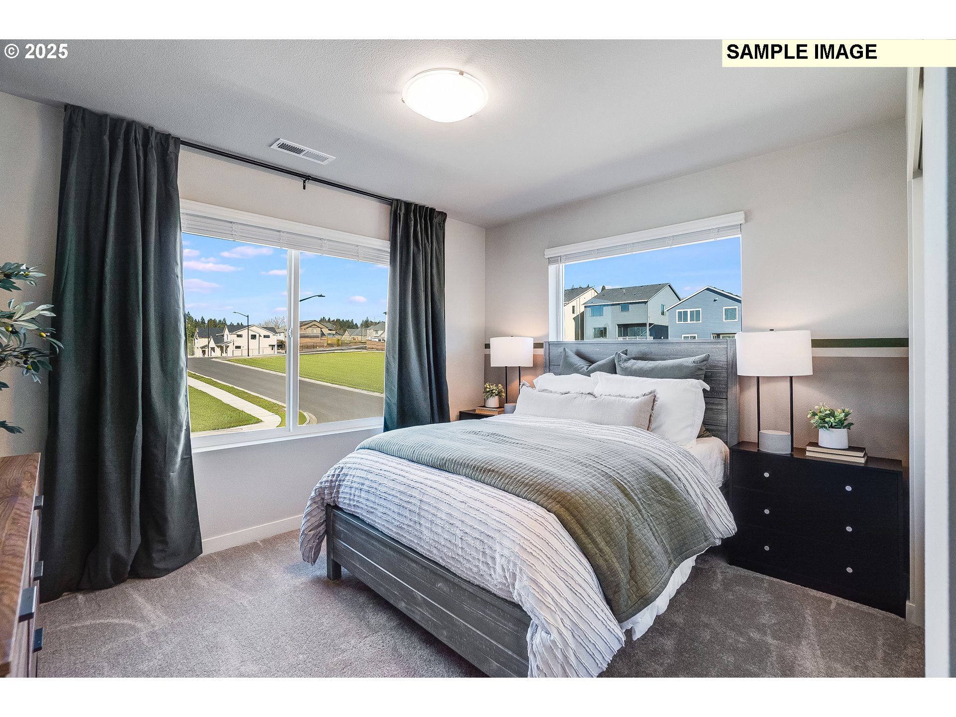 16698 Southwest Rubicon Lane Portland, OR 97224 - Photo 21 of 28 a bedroom with a bed and a large window
