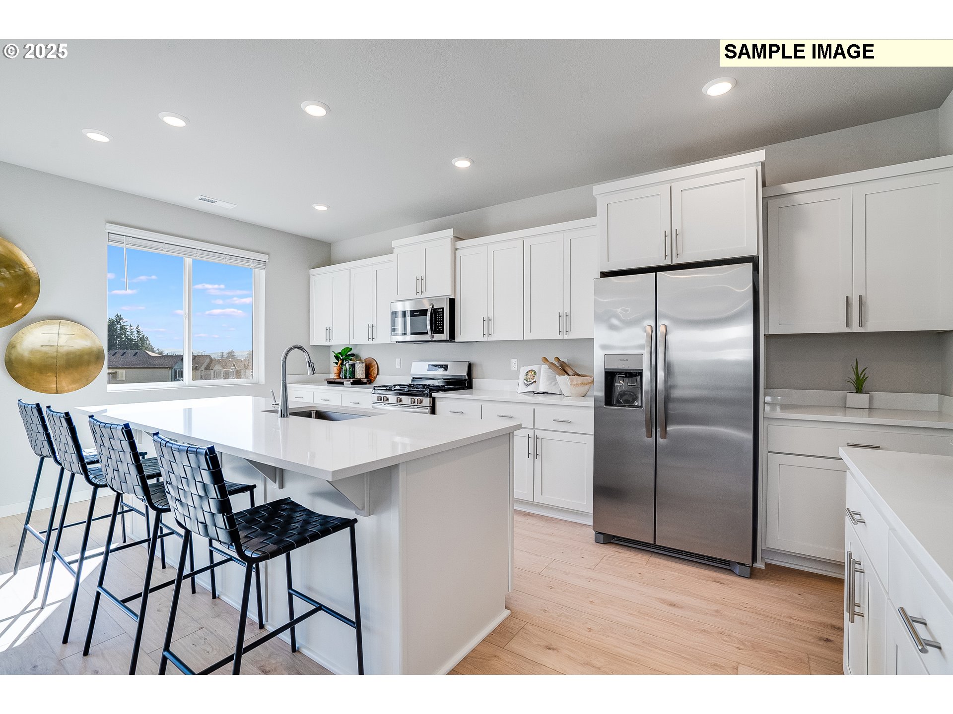 16698 Southwest Rubicon Lane Portland, OR 97224 - Photo 3 of 28 a kitchen with stainless steel appliances a refrigerator a stove a sink dishwasher a stove and white cabinets
