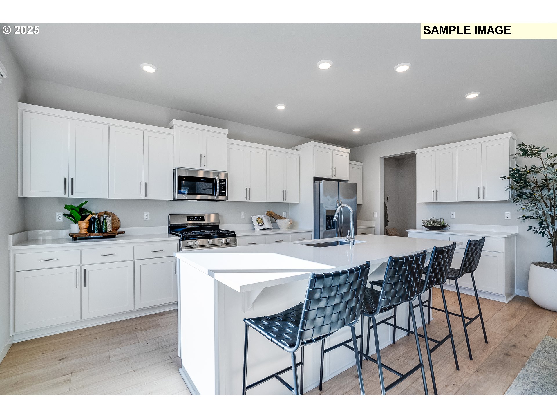 16698 Southwest Rubicon Lane Portland, OR 97224 - Photo 5 of 28 a kitchen with a dining table cabinets appliances and a window