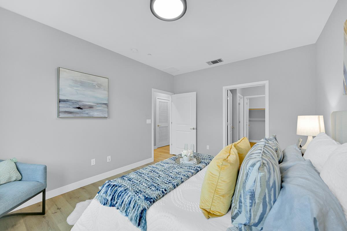 334 Circuit Way Mountain View, CA 94043 - Photo 14 of 48 a spacious bedroom with a bed and painting on the wall