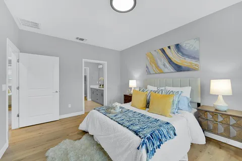 a bedroom with a bed and window