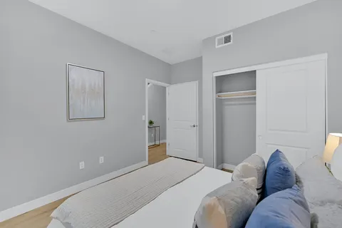 a bedroom with bed and a window