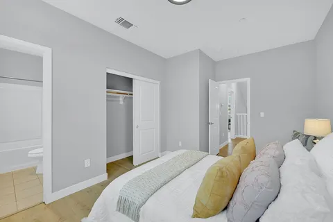 a bedroom with a bed and a cabinets