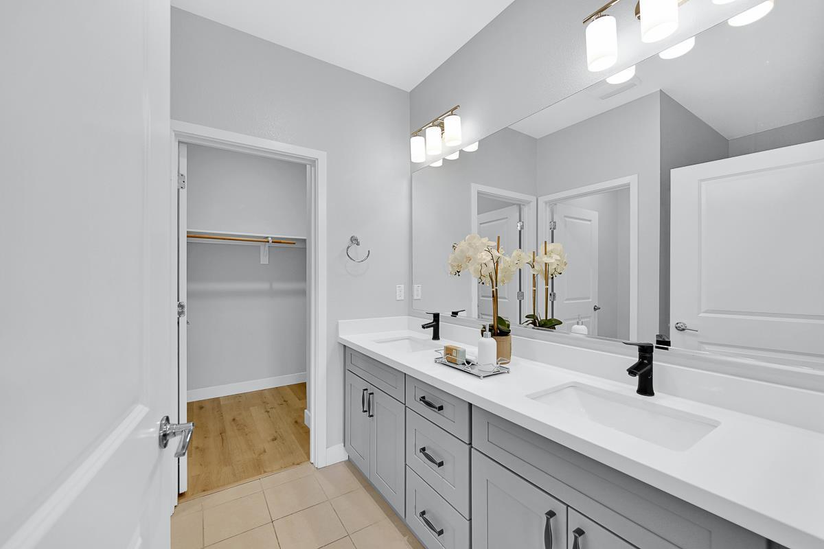 334 Circuit Way Mountain View, CA 94043 - Photo 27 of 48 a bathroom with a double vanity sink a mirror and a shower
