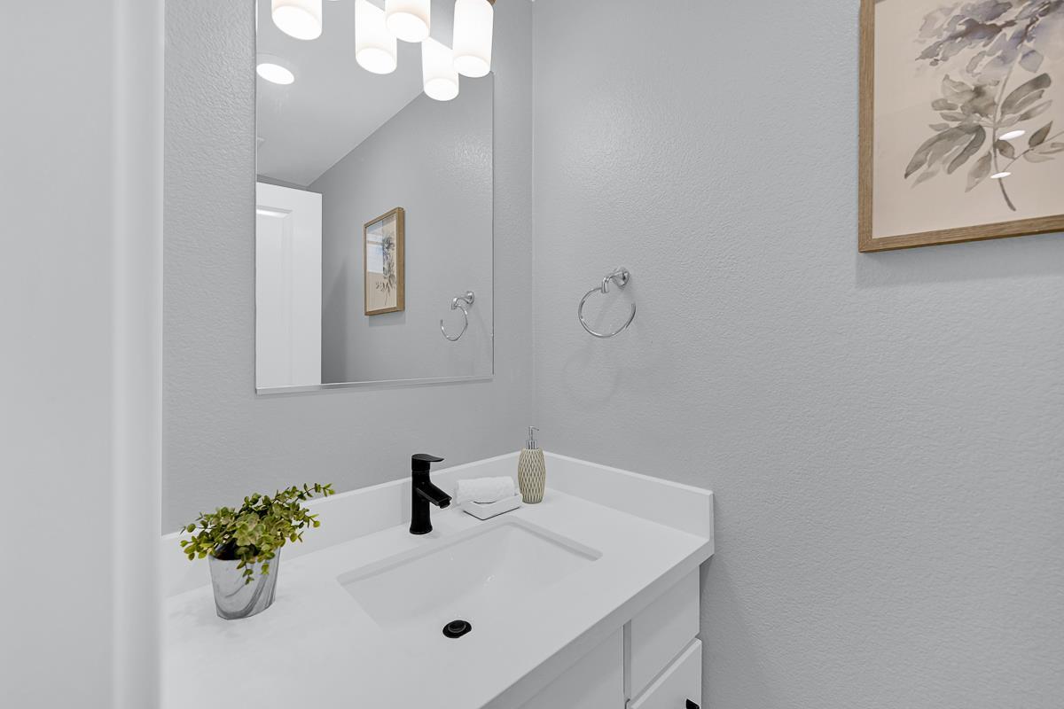 334 Circuit Way Mountain View, CA 94043 - Photo 30 of 48 a bathroom with a sink a mirror and vanity