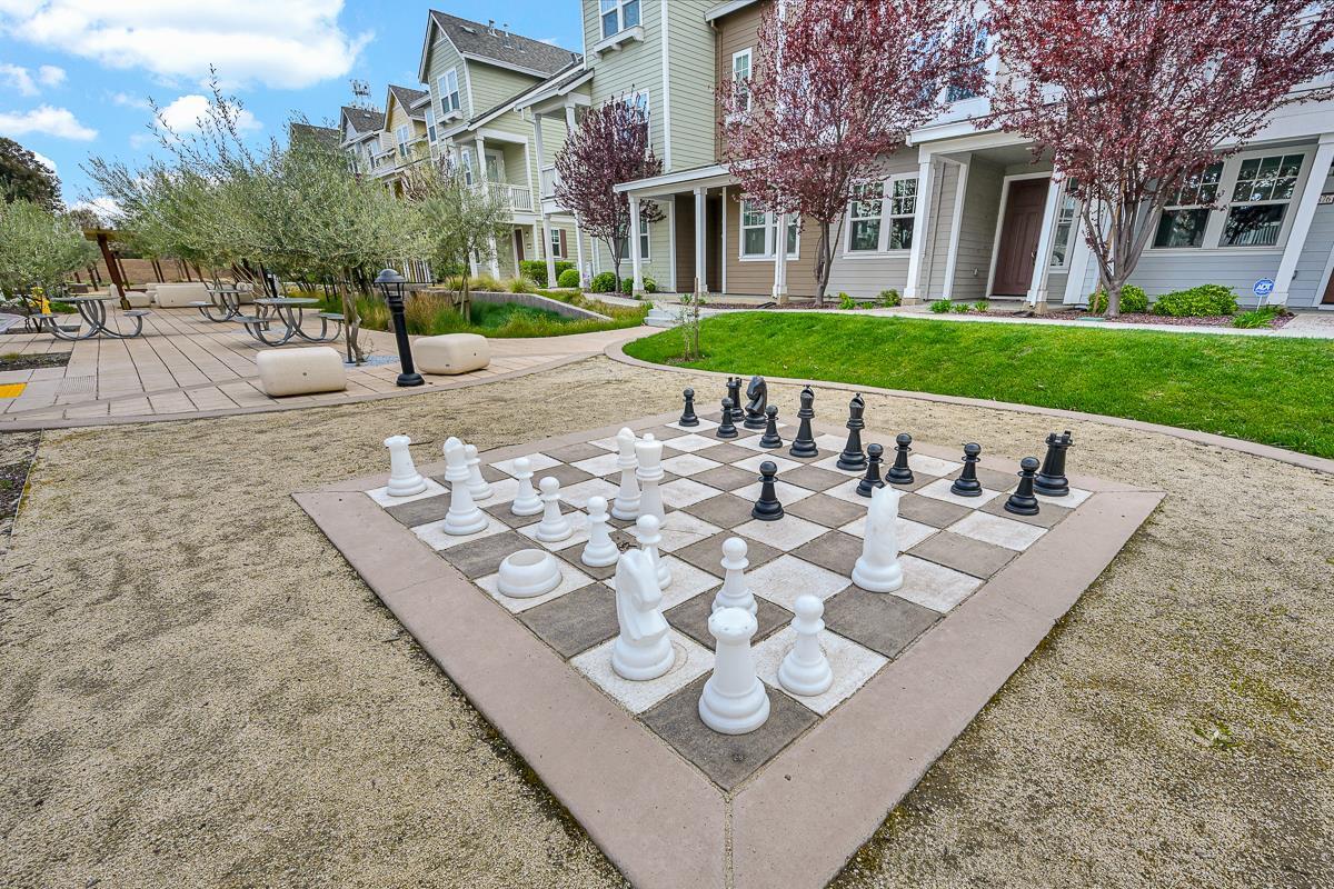 334 Circuit Way Mountain View, CA 94043 - Photo 43 of 48 a view of a white house with a yard
