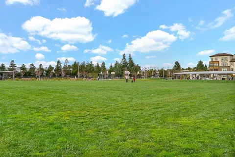 a view of a building with a yard