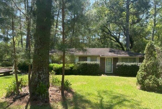 4733 Orr Road Pelham, GA 31779 - Photo 1 of 1 a front view of a house with a yard