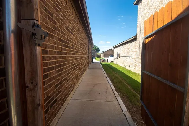 a view of a pathway of a building from a balcony