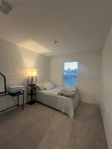 a living room with furniture and window