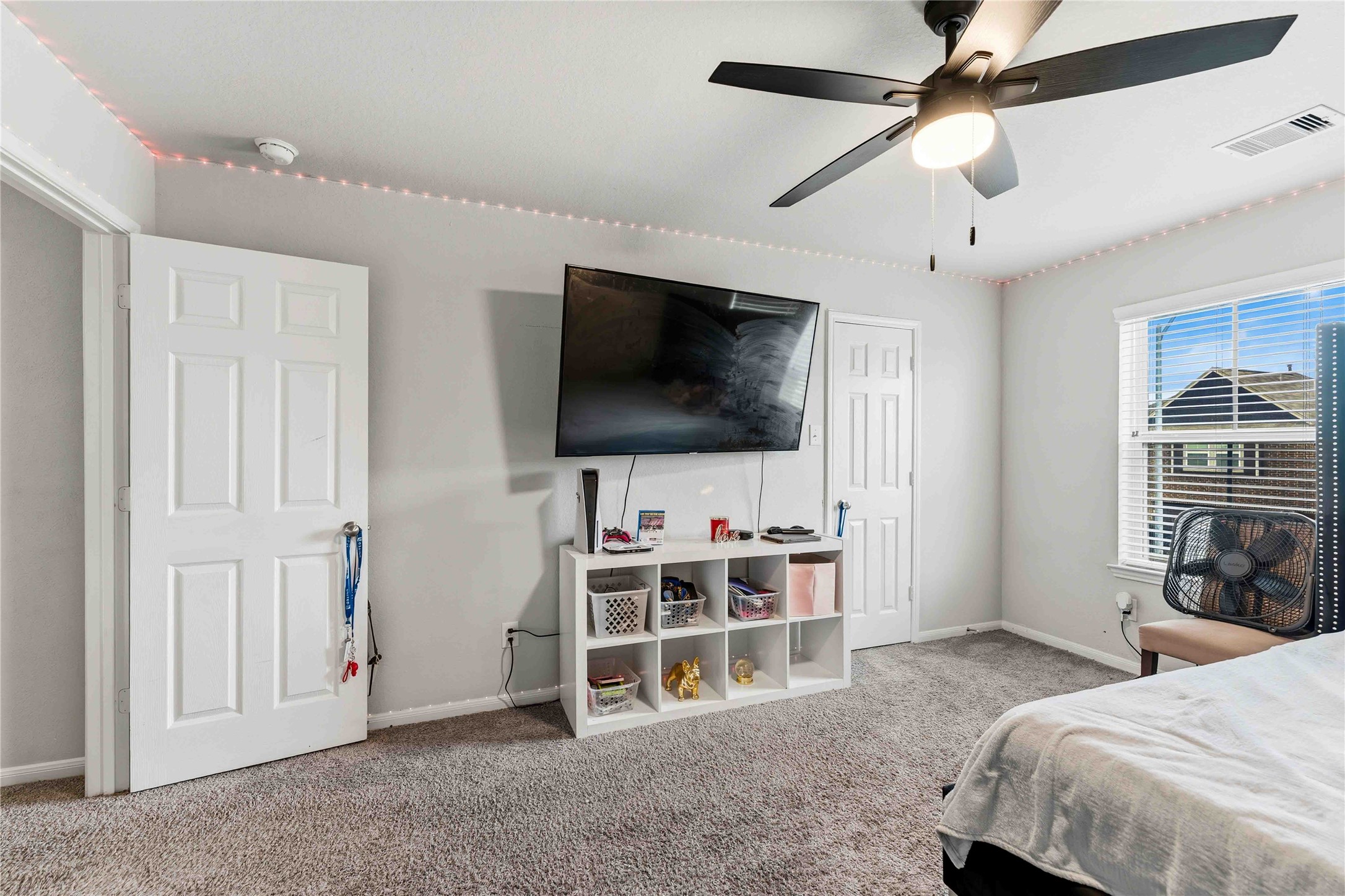 14810 Ruddy Duck Lane Houston, TX 77049 - Photo 19 of 33 a bedroom with furniture and a flat screen tv