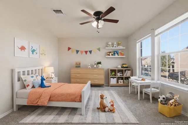 a bedroom with furniture and a wooden floor