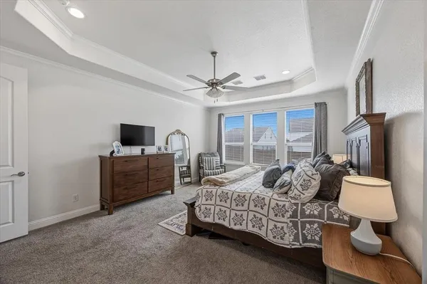 a bedroom with bed and window