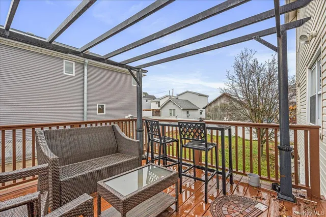 a view of a balcony with furniture