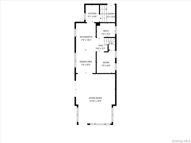 a picture of a bench in front of a wall