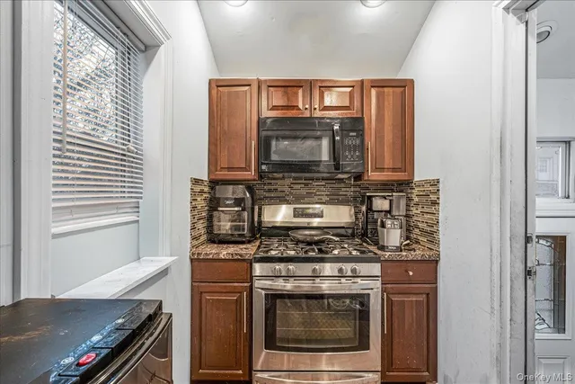 a kitchen with a stove and a microwave