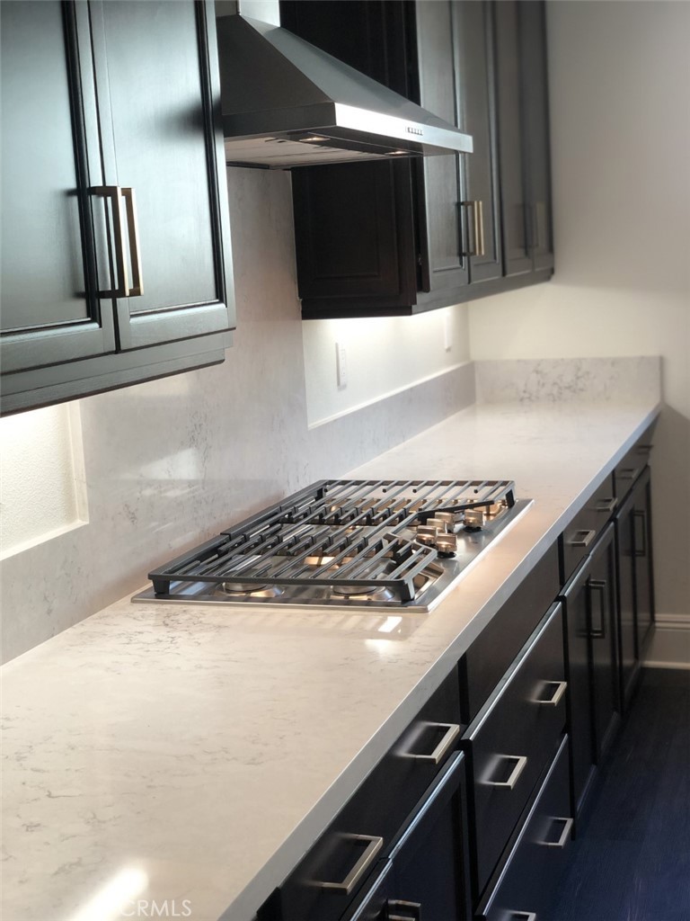 39538 Verbena Way Temecula, CA 92591 - Photo 11 of 38 a stove top oven sitting inside of a kitchen