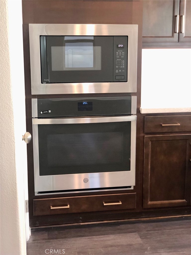 39538 Verbena Way Temecula, CA 92591 - Photo 12 of 38 a stove top oven sitting inside of a kitchen