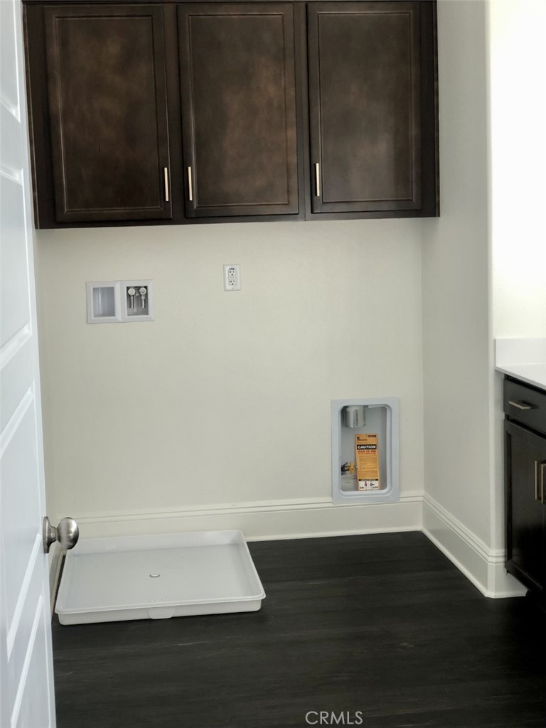39538 Verbena Way Temecula, CA 92591 - Photo 19 of 38 a bathroom with a wooden floor and a microwave