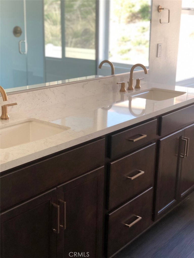 39538 Verbena Way Temecula, CA 92591 - Photo 21 of 38 a close up of a sink a mirror and a window