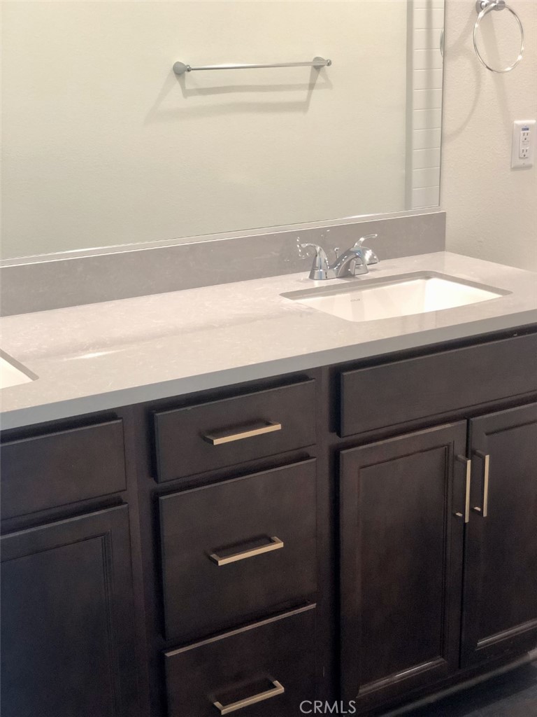 39538 Verbena Way Temecula, CA 92591 - Photo 27 of 38 a bathroom with a sink and a mirror
