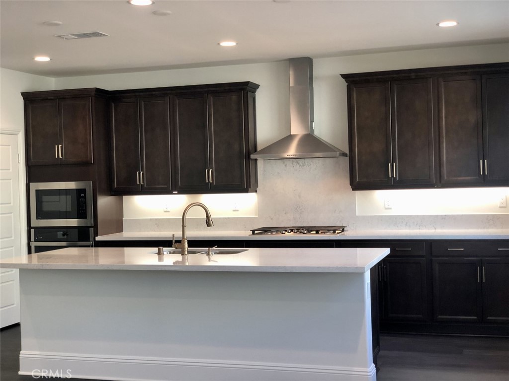 39538 Verbena Way Temecula, CA 92591 - Photo 7 of 38 a sink with a cabinets and window