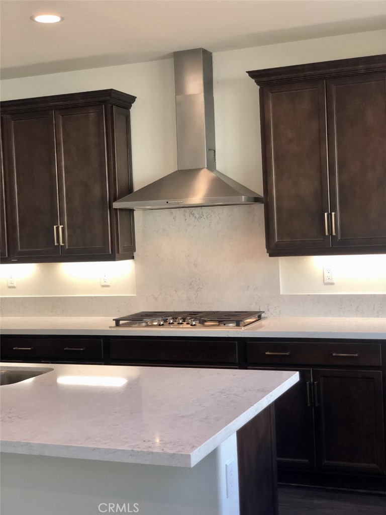 39538 Verbena Way Temecula, CA 92591 - Photo 8 of 38 a kitchen with a sink and a refrigerator