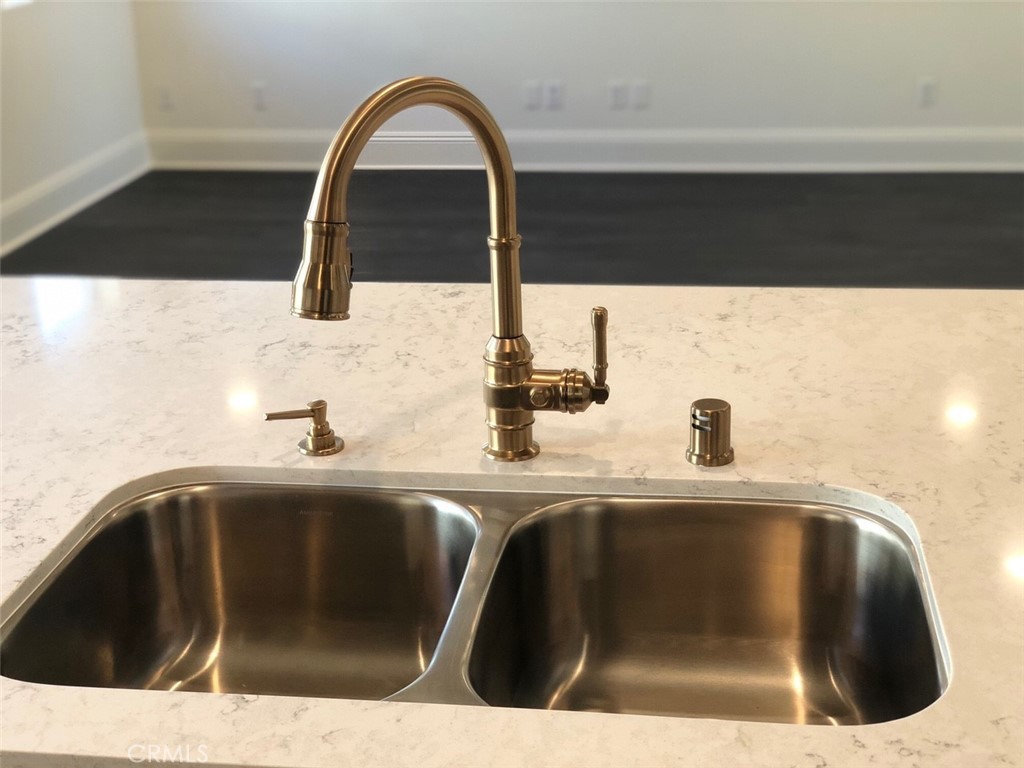 39538 Verbena Way Temecula, CA 92591 - Photo 10 of 38 a kitchen with a sink and a mirror