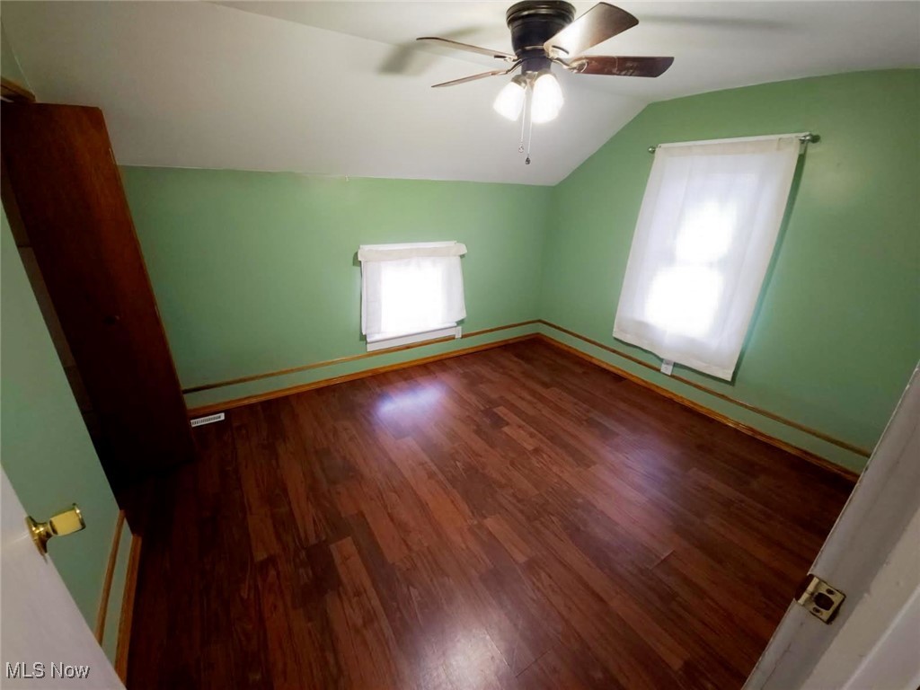 30 Medina Street Rittman, OH 44270 - Photo 22 of 28 Bonus room with vaulted ceiling, dark wood-type flooring, and ceiling fan