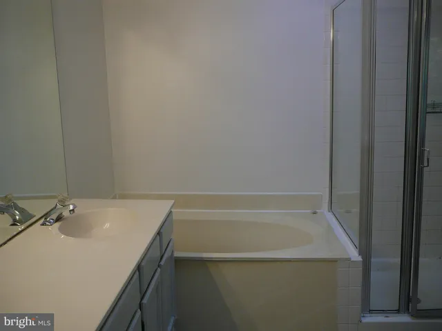 a bathroom with a sink and a bathtub
