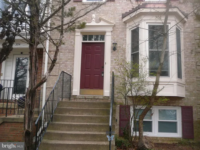 a front view of a house with a lots of windows