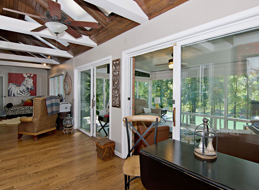11001 Lake Ridge Lane Seneca, SC 29672 - Photo 18 of 50 Gleaming hardwood floors and a beamed vaulted ceiling create a warm, inviting atmosphere.