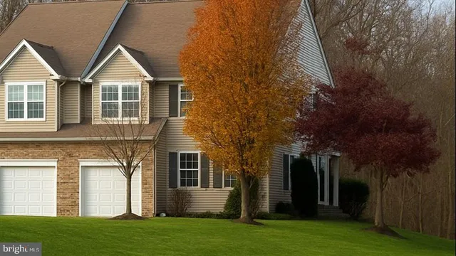 front view of a house with a yard