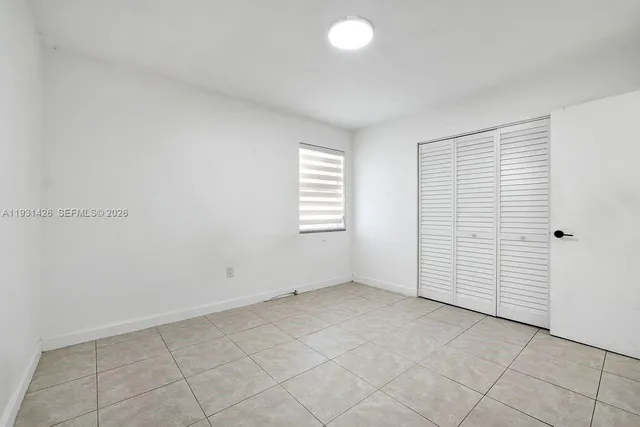 an empty room with a bathroom