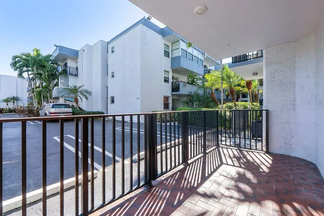 a view of a house with potted plants