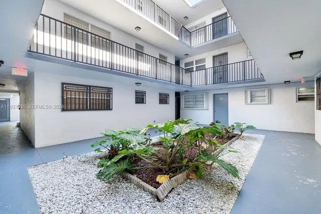 a view of a house with a yard and garage