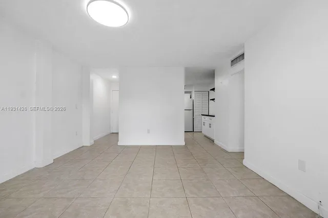 a kitchen with stainless steel appliances granite countertop a sink and a stove