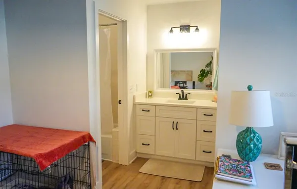 a en suite bathroom with a sink mirror and vanity