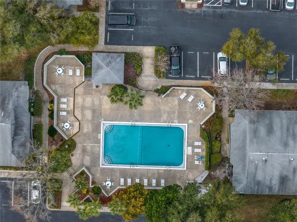 an aerial view of a house with a yard and a fireplace