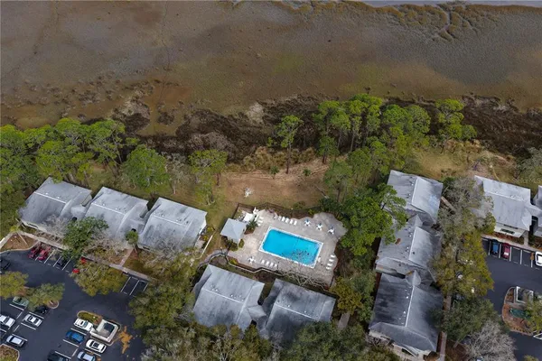 an aerial view of a house with a lake view