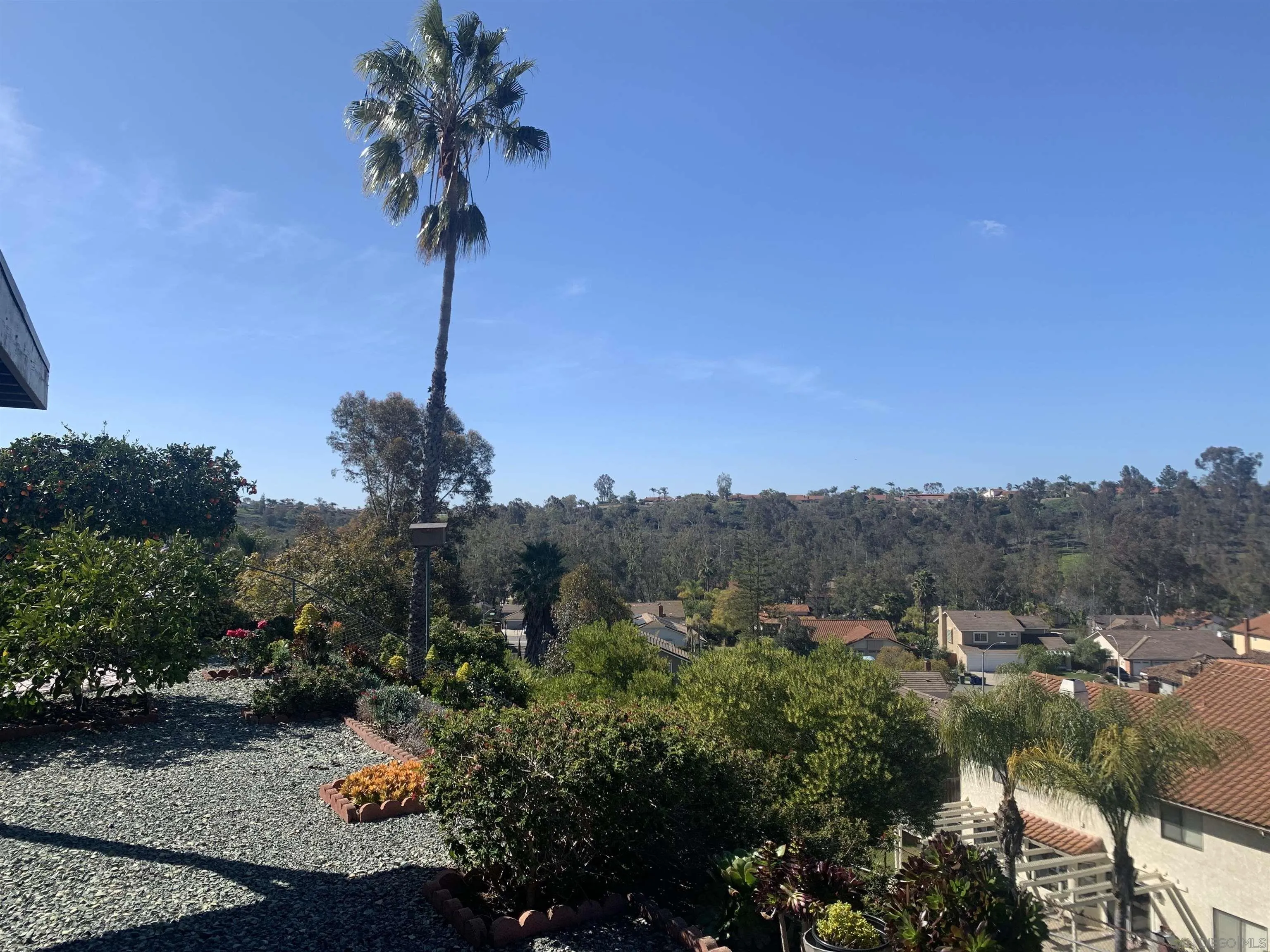 14738 Dash Way Poway, CA 92064 - Photo 3 of 4 a view of a terrace with a garden