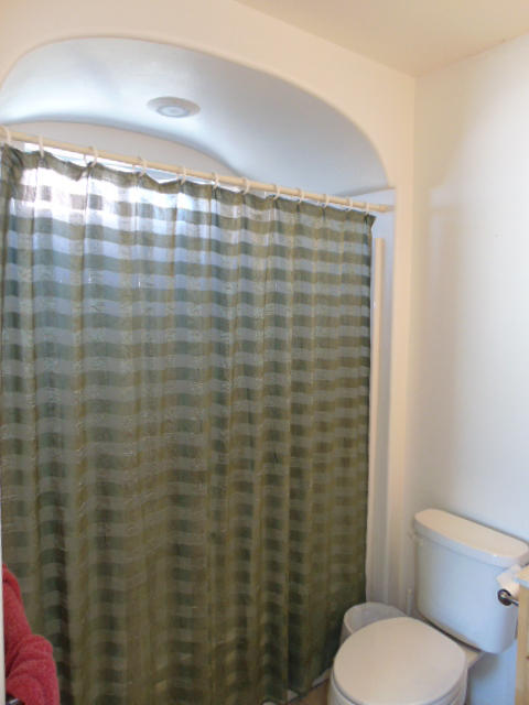 3545 East Rimrock Drive Rimrock, AZ 86335 - Photo 15 of 19 a bathroom with a toilet and a shower curtain