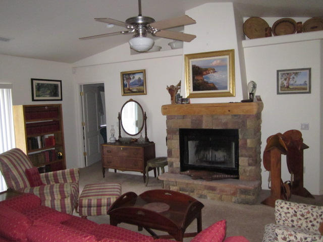 3545 East Rimrock Drive Rimrock, AZ 86335 - Photo 2 of 19 a living room with furniture and a fireplace